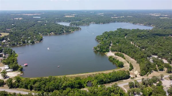 an aerial view of lake residential house and space