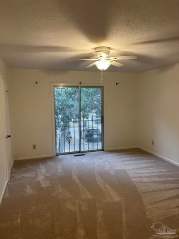 a bathroom with a granite countertop toilet and a sink