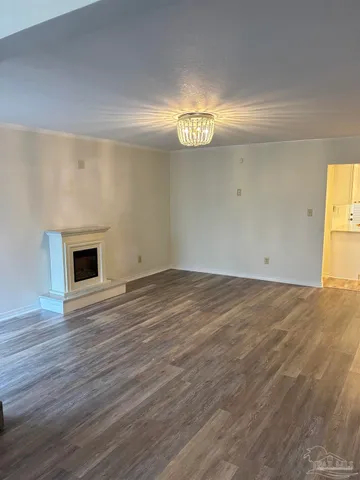 a kitchen with appliances a sink and cabinets