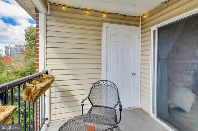 a view of a balcony with furniture