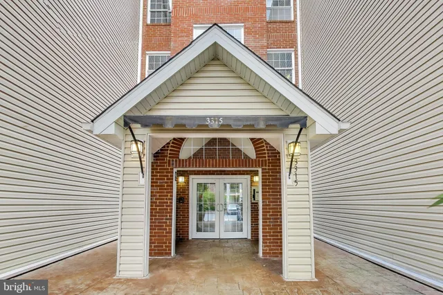 a view of a small house with wooden stairs