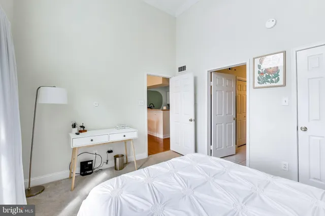 a bedroom with a bed and a closet