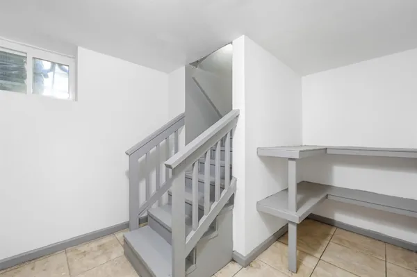 a bathroom with a toilet sink vanity tub and shower
