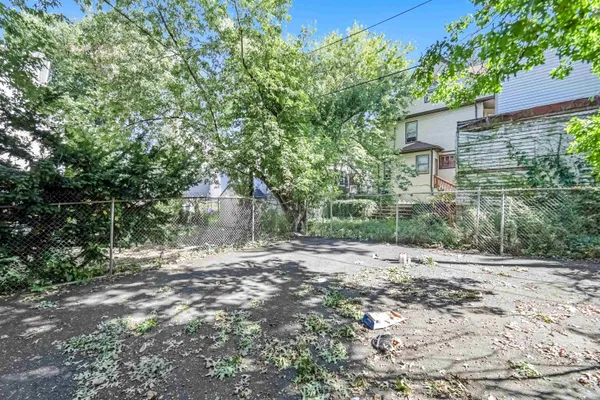 a workspace with wooden floor and a window
