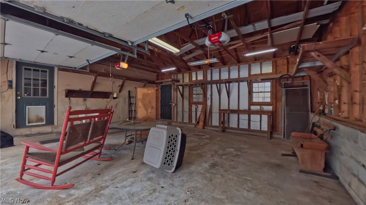 48276 Dyke Road Negley, OH 44441 - Photo 27 of 30 Garage featuring a garage door opener