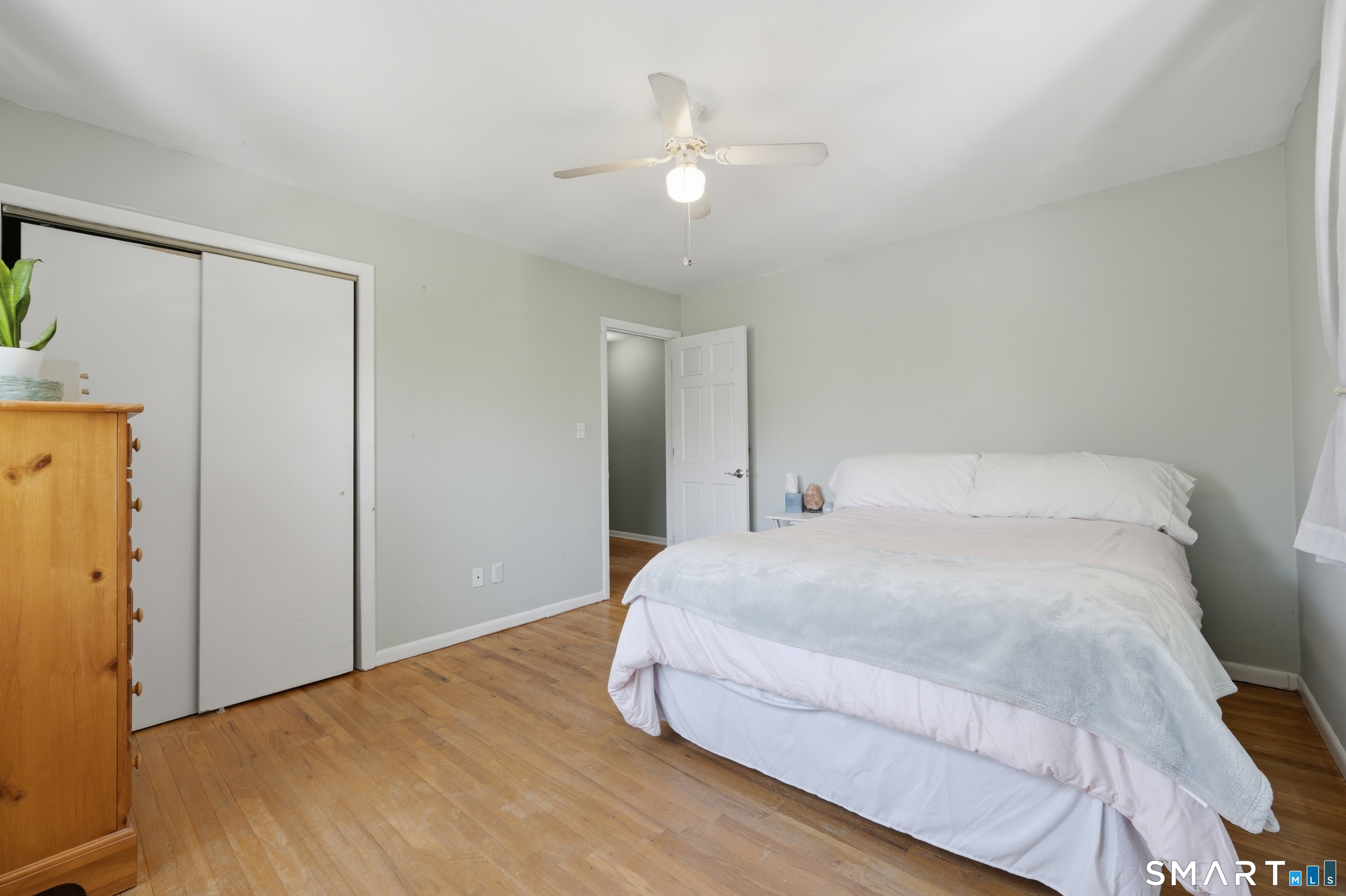114 Beacon Valley Road Beacon Falls, CT 06403 - Photo 19 of 38 a bedroom with a bed and a ceiling fan