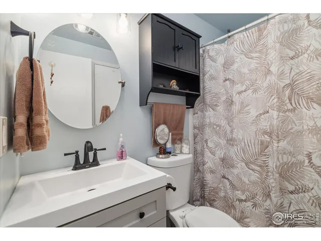 a bedroom with a bed and a table