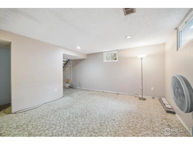 a utility room with cabinets dryer and washer