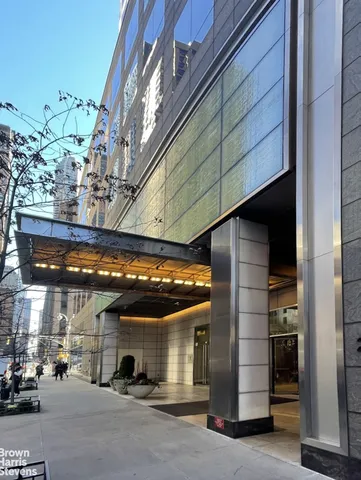 a balcony view with a rug