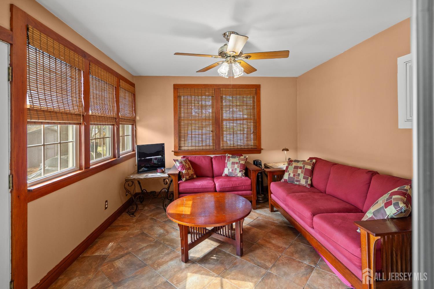 131 Woodland Road Piscataway, NJ 08854 - Photo 12 of 40 a living room with furniture and a large window