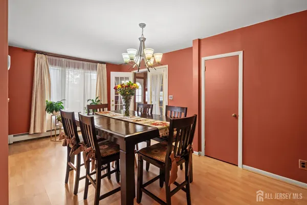 a view of a dining room with furniture and window