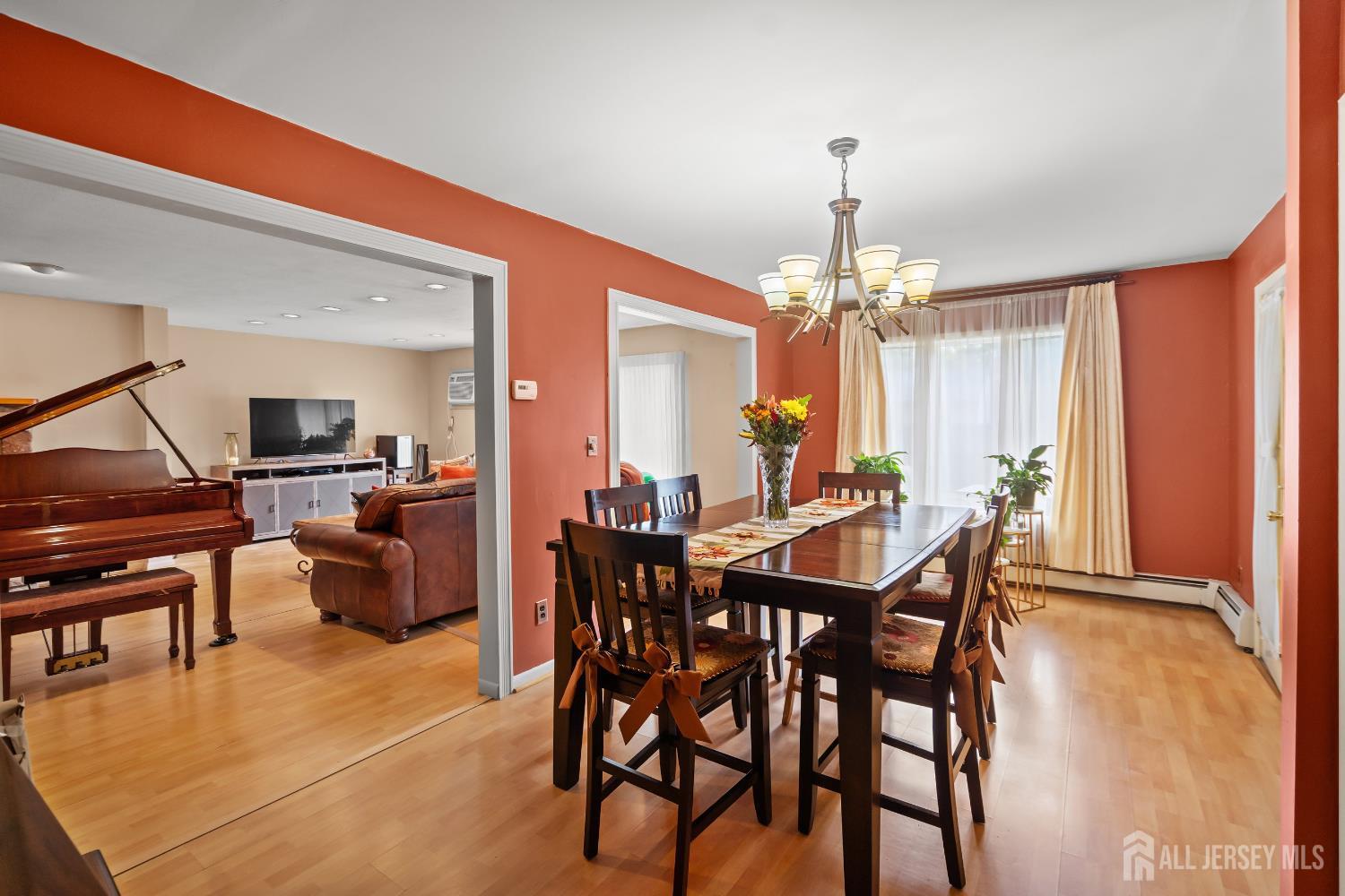 131 Woodland Road Piscataway, NJ 08854 - Photo 15 of 40 a view of a dining room with furniture window and wooden floor