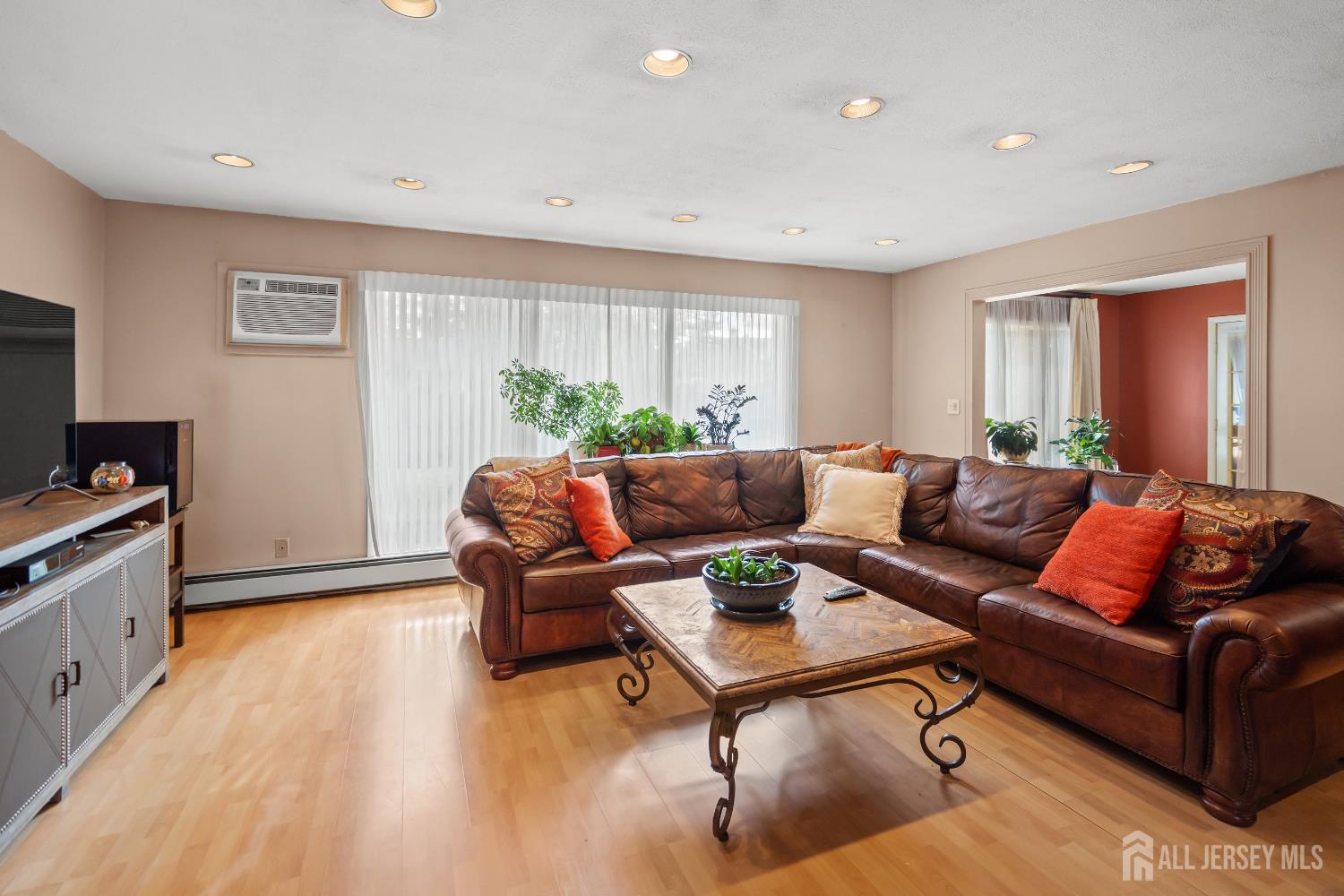 131 Woodland Road Piscataway, NJ 08854 - Photo 17 of 40 a living room with furniture and a flat screen tv