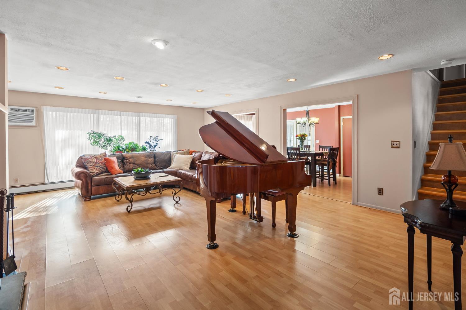 131 Woodland Road Piscataway, NJ 08854 - Photo 18 of 40 a living room with furniture and wooden floor