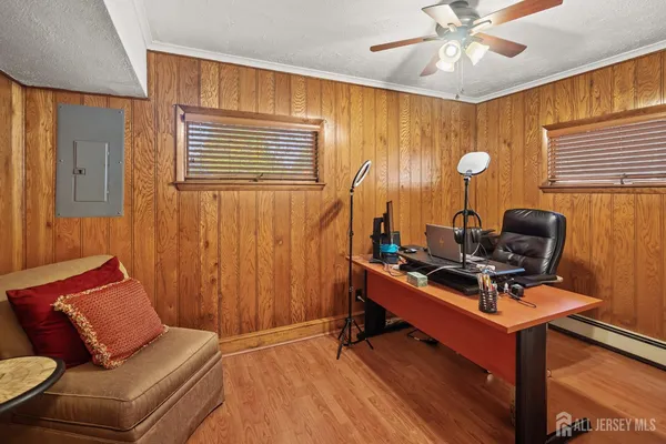 a view of workspace with wooden floor windows