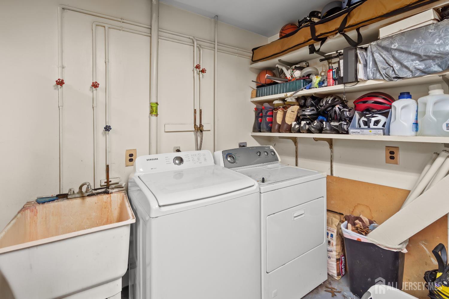 131 Woodland Road Piscataway, NJ 08854 - Photo 34 of 40 a utility room with dryer and washer