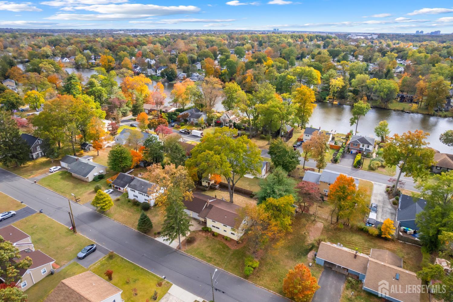 131 Woodland Road Piscataway, NJ 08854 - Photo 4 of 40 an aerial view of residential building with outdoor space and lake view