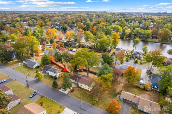 an aerial view of residential building with outdoor space and lake view