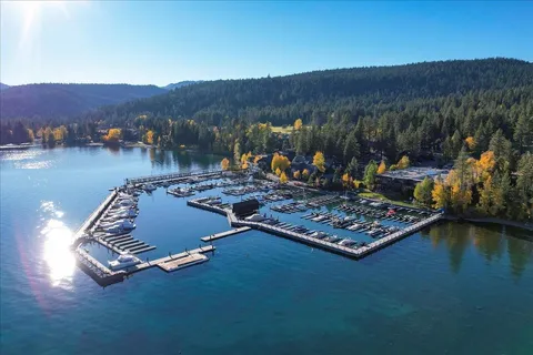 an aerial view of a house with a lake view