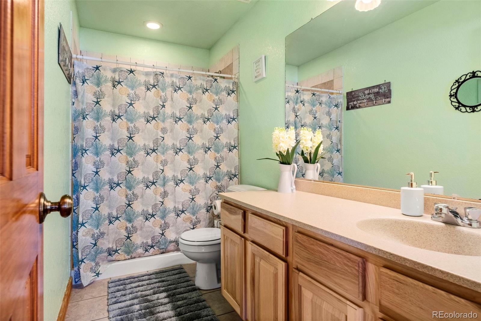 412 Evergreen Road Black Hawk, CO 80422 - Photo 40 of 48 a bathroom with a sink and a mirror