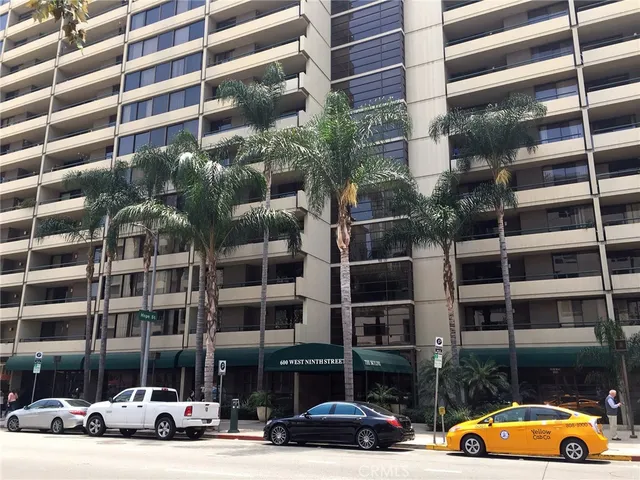 a front view of a building with street view