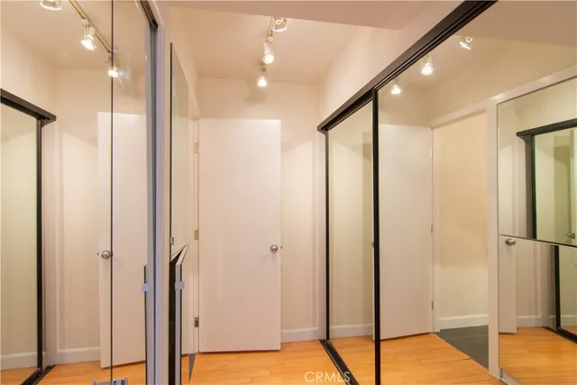 a bathroom with a shower and a glass door
