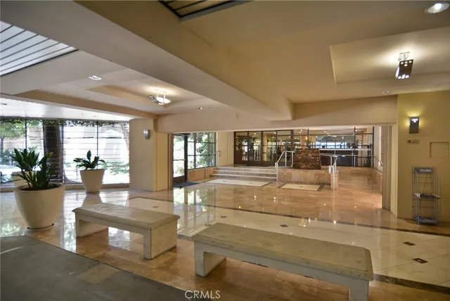a view of a lobby with black carpet