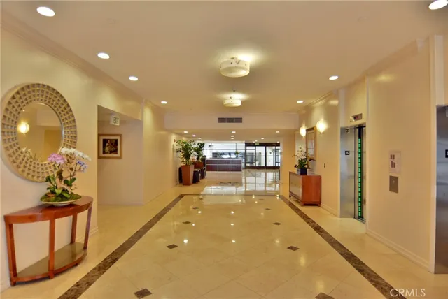 a view of a lobby with black carpet