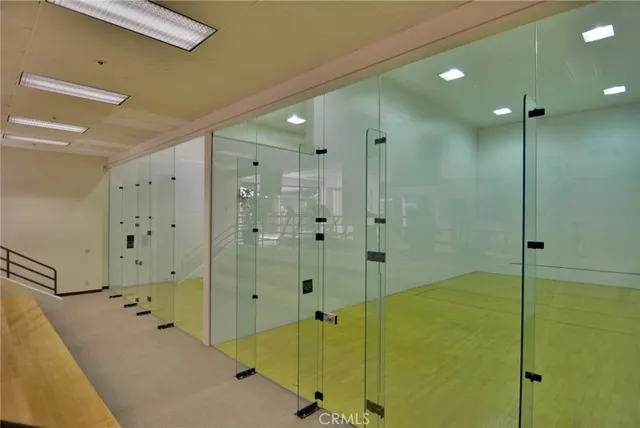 a bathroom with a glass shower door