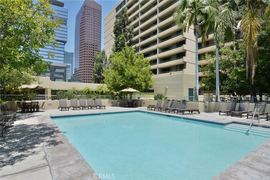 600 West 9th Street, Unit 1114 Los Angeles, CA 90015 - Photo 25 of 27 a view of a swimming pool with outdoor seating and plants