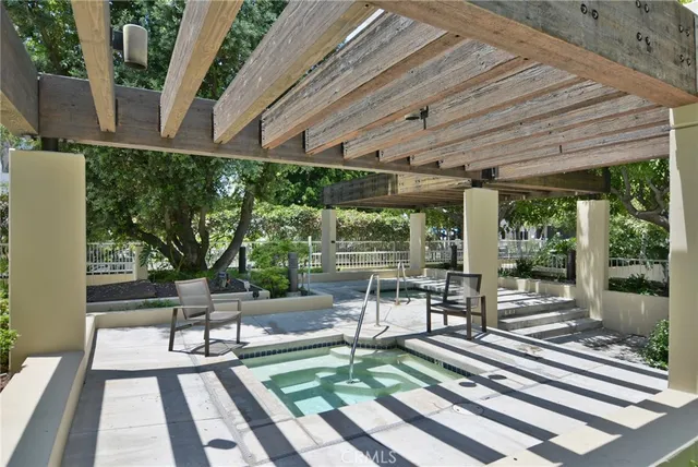a view of a patio with table and chairs floor to ceiling window with wooden floor
