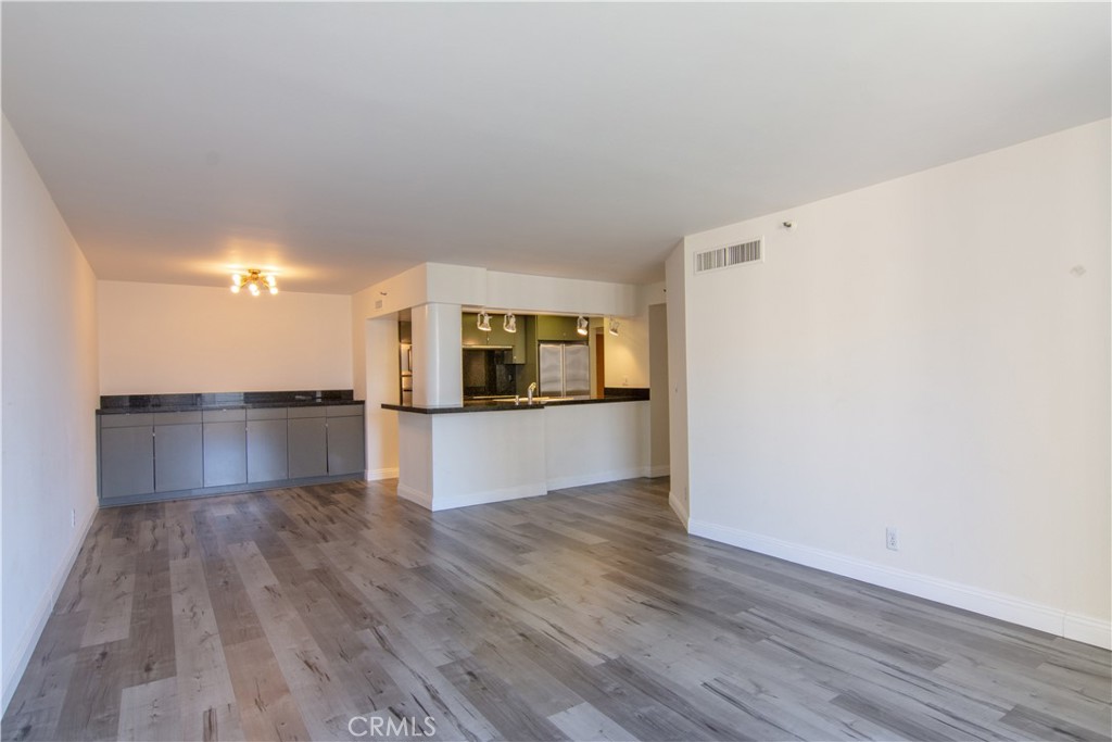 600 West 9th Street, Unit 1114 Los Angeles, CA 90015 - Photo 8 of 27 a kitchen with a refrigerator and a stove top oven