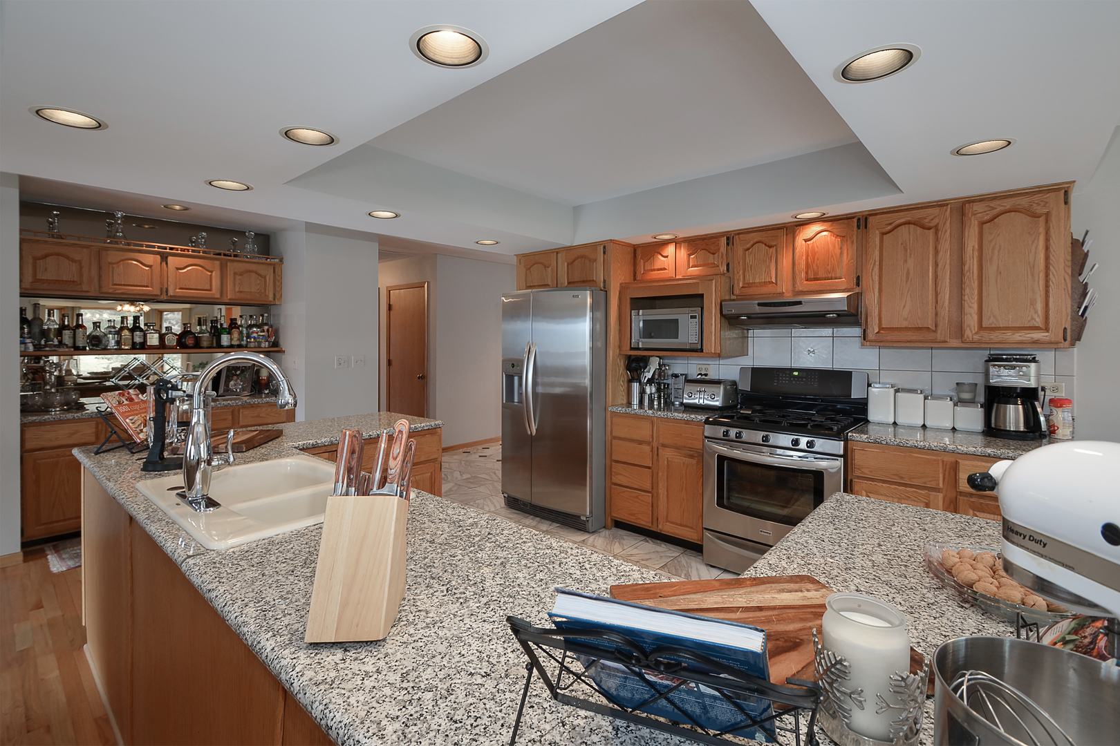 102 North Haman Road Inverness, IL 60010 - Photo 12 of 25 a kitchen with stainless steel appliances granite countertop a sink a stove and a refrigerator