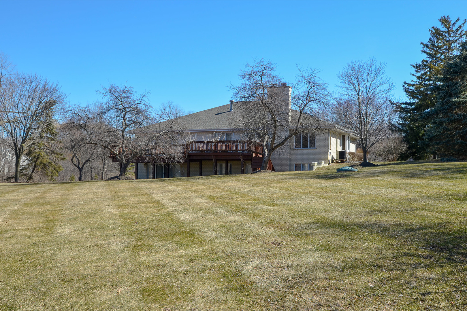 102 North Haman Road Inverness, IL 60010 - Photo 24 of 25 a view of house with yard and trees in the background