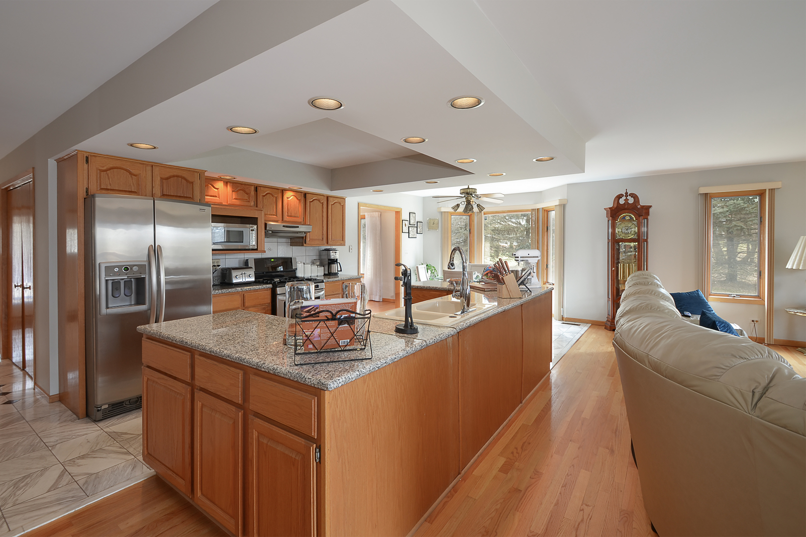 102 North Haman Road Inverness, IL 60010 - Photo 6 of 25 a kitchen with stainless steel appliances granite countertop a sink a stove and a refrigerator
