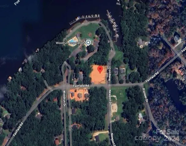 an aerial view of a residential houses with street