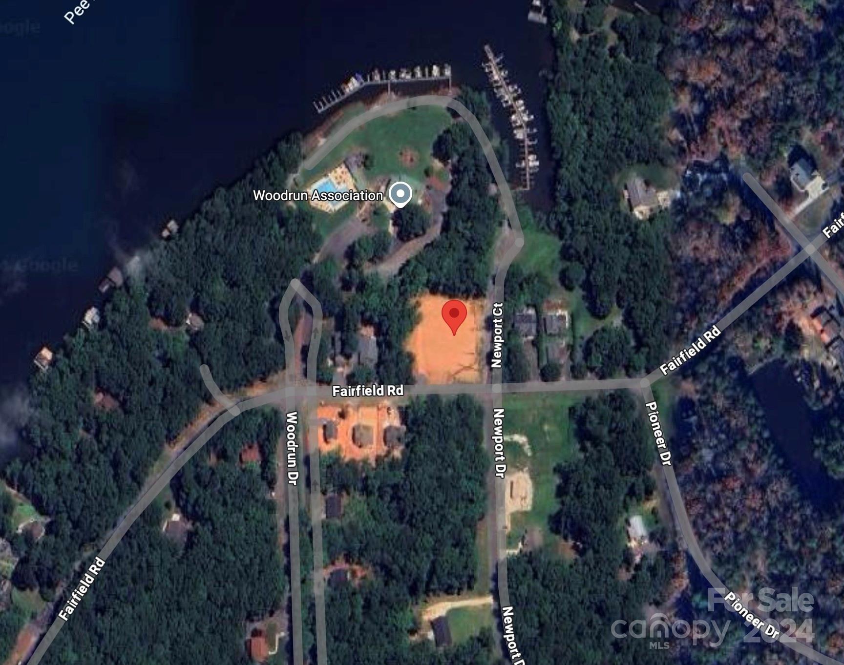 an aerial view of a residential houses with street