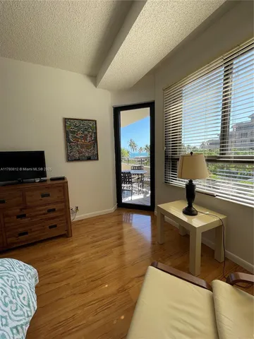 a room with furniture and wooden floor