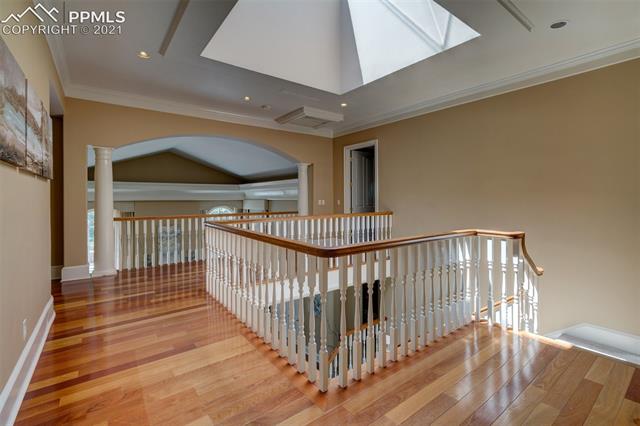 23 Pourtales Road Colorado Springs, CO 80906 - Photo 23 of 26 Upper level landing with 9' x 9' skylight
