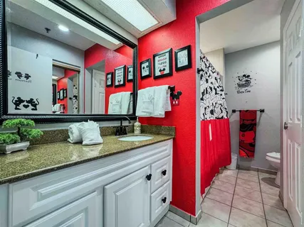 a kitchen with stainless steel appliances granite countertop a sink and a microwave