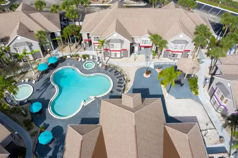 an aerial view of a swimming pool outdoor seating