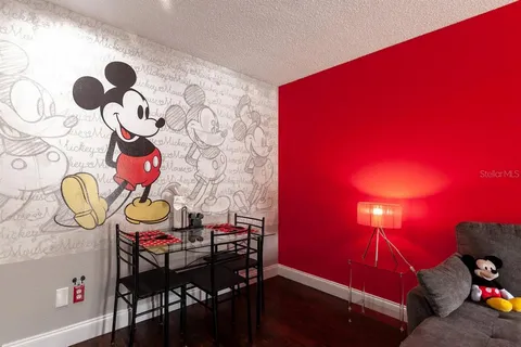 a view of a room with furniture and chandelier