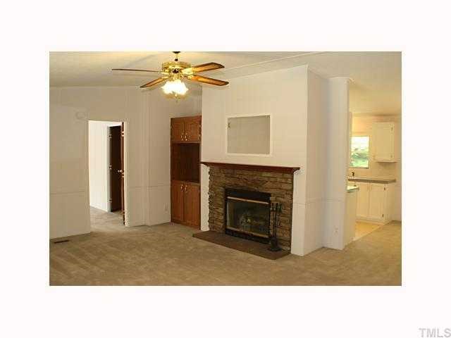122 Fairview Road Louisburg, NC 27549 - Photo 3 of 9 Spacious Living Room with wood burning fireplace.