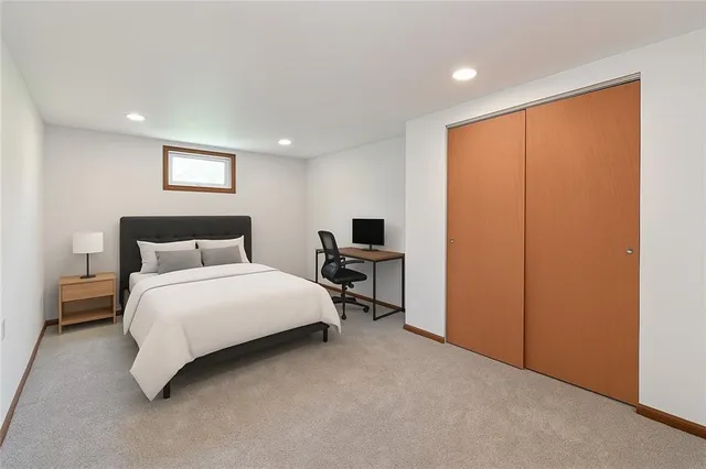 a bedroom with a bed and a tv