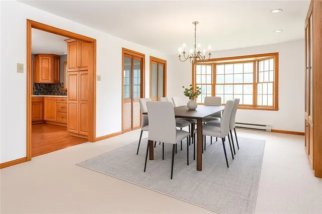 a dining room with furniture window wooden floor