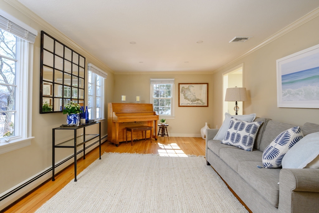 7 Village Lane Hingham, MA 02043 - Photo 14 of 34 a living room with furniture and a flat screen tv with wooden floor