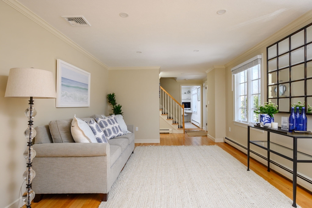 7 Village Lane Hingham, MA 02043 - Photo 15 of 34 a living room with furniture and a flat screen tv
