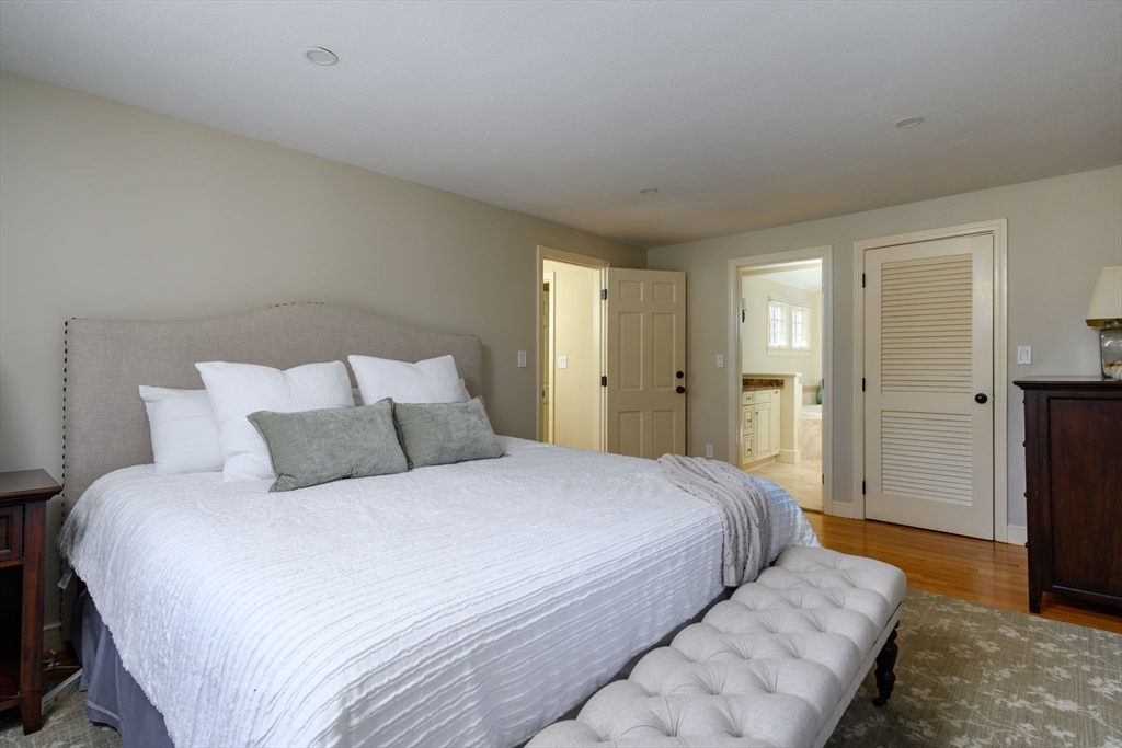 7 Village Lane Hingham, MA 02043 - Photo 18 of 34 a bedroom with a bed and a walk in closet