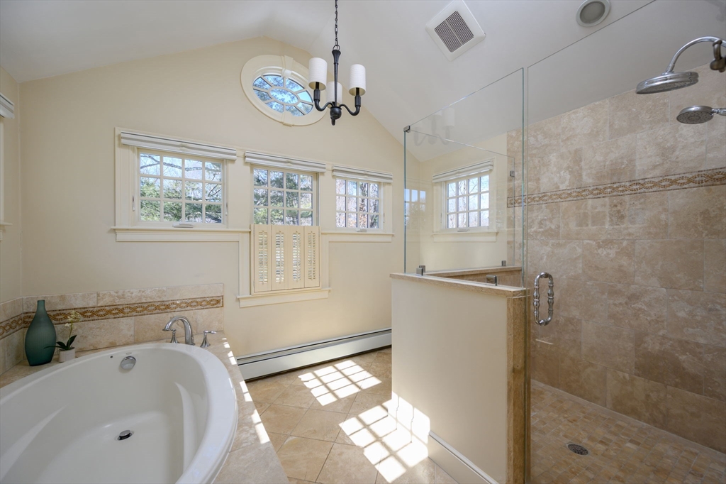 7 Village Lane Hingham, MA 02043 - Photo 20 of 34 a bathroom with a tub sink and mirror