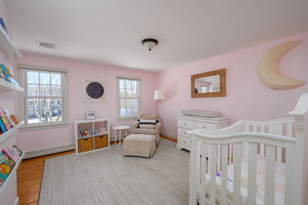 7 Village Lane Hingham, MA 02043 - Photo 21 of 34 a bedroom with furniture and a large window
